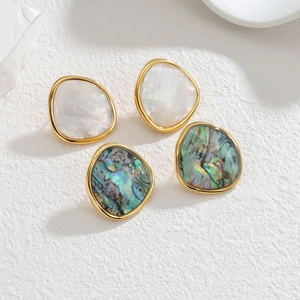 Irregular geometric mother of pearl and abalone shell stud earrings in gold plated finish
