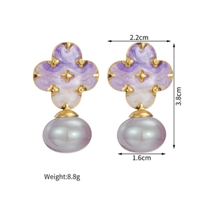 Detailed view of flower earrings with purple marble texture, pearl drop and size metrics
