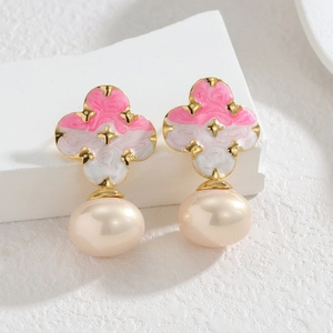 Pink clover earrings with gold butterfly, star accents, and large pearl drop charms