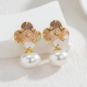 Elegant gold drop earrings with marble enamel clover charm and large lustrous white pearl