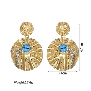 Macro shot of large 18k gold round earrings with blue eye detail and 4.9cm height