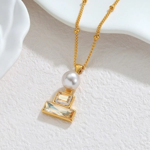 Minimalist 18k gold geometric necklace with white pearl and champagne crystal pendants