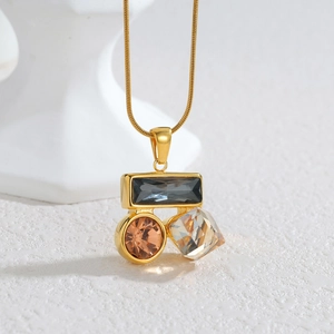 Geometric zircon necklace with grey amber and clear stones on a fine gold chain