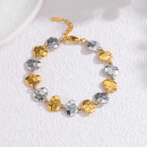 Two-tone hammered oval link bracelet in gold and silver finish with lobster clasp