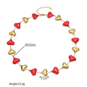 Macro shot of gold stainless steel heart necklace showing length 45cm and S.Steel tag