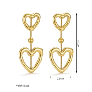 Macro detail of 18k gold plated hollow heart earrings with dimensions and weight info