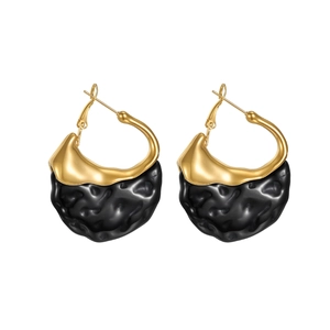 French vintage resin earrings with irregular gold and black texture in a minimalist design