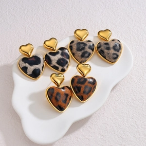Three pairs of vintage leopard print heart earrings with 18k gold-plated metal studs