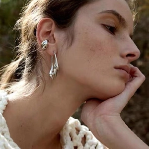 Minimalist silver teardrop earrings and ear cuff set with a polished mirror finish