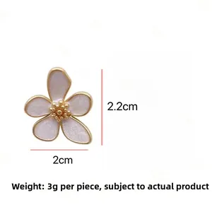 Detailed view of five-petal flower stud earring in pink enamel with gold-plated edges
