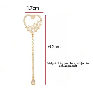 Detailed size view of gold heart tassel earrings with dimensions 1.7cm width and 6.2cm height
