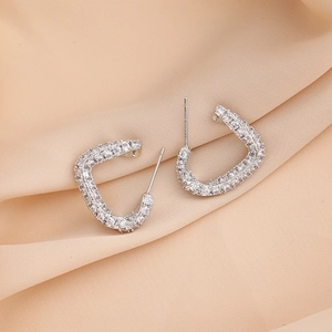 Sparkling silver-tone C-shape hoop earrings with micro-pave zircons on silk fabric