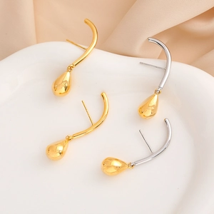 Minimalist 18K gold and silver plated teardrop earrings on a white silk background