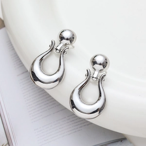 Polished silver U-shaped drop earrings with spherical studs in minimalist French vintage style