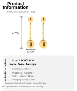 Detail view of 4.7cm gold fringe earrings with dimensions and polished ball drop