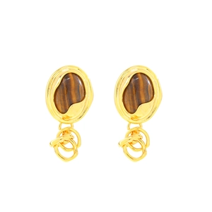 Elegant gold earrings with tiger eye stone and irregular metal rings on white background