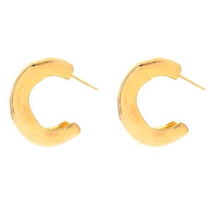 Exaggerated gold C-shaped twisted earrings with hammered metal texture on white background
