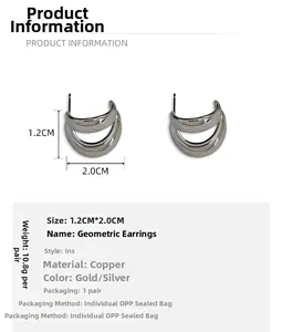 Macro detail of layered streamlined silver geometric earrings with 1.2cm by 2.0cm dimensions