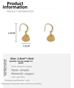 Detailed view of gold and silver copper earrings with 2.8cm x 1.0cm dimensions
