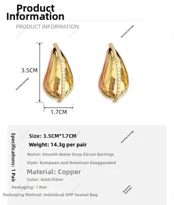 Detail view of gold teardrop earrings with zirconia, measuring 3.5cm by 1.7cm in size