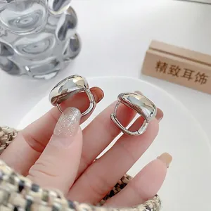 Minimalist chunky silver hoop earrings with a mirror-polished finish for women