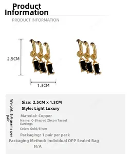 Detail of C-shaped 18K gold plated tassel earrings with black zircon stones and measurements