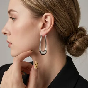 Minimalist silver U-shaped hoop earrings featuring a polished long oval drop design