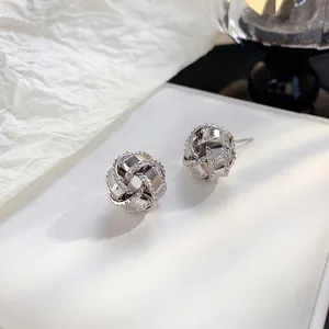 Elegant silver sphere woven knot stud earrings with 18K gold plating for a luxury look