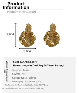 Detailed view of irregular hammered gold earrings with size measurements in centimeters
