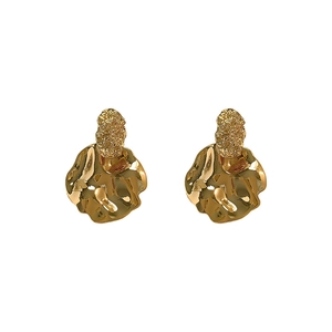 Irregular organic shaped gold-plated earrings with lava texture and wave disc design