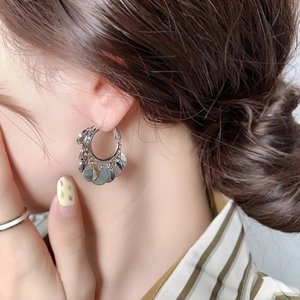 Chic silver hoop earrings with polished metal sequins for a minimalist aesthetic