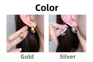 Detailed comparison of chunky C-shaped hoop earrings in polished gold and silver finishes