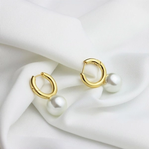 Elegant 18K gold plated brass hoop earrings with large round pearls on white silk