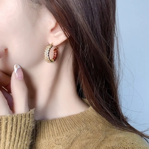 Elegant C-shaped gold plated earrings with sparkling zircon and brown enamel inlay