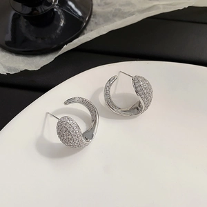 Silver-tone C-shape earrings with micro-paved zircons and sleek streamlined design