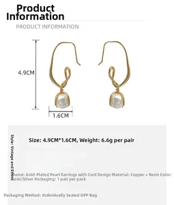 Detailed view of knot-design gold-plated earrings with drop pearls and dimensions
