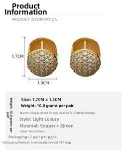 Macro detail of gold-plated oval hoop earrings with zircon pavé and 1.7cm dimensions