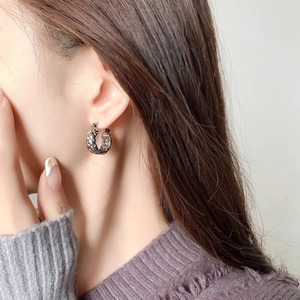 Silver quilted pattern hoop earrings in a minimalist round metal design for women