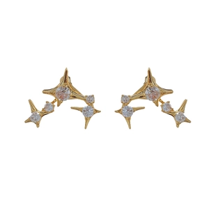 Chic gold-plated starburst stud earrings with sparkling cubic zirconia on white background