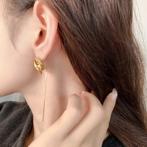 24K gold plated rose chain tassel earrings with twisted metal rings on female model