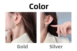 Close-up of geometric triangle earrings with cubic zirconia in gold and silver plating
