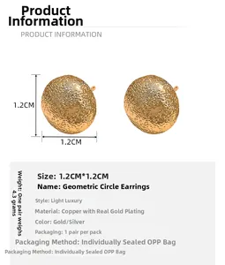 Detail showing 1.2cm textured geometric earrings in gold-plated copper material