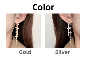 Elegant gold and silver cross drop earrings with tassels and crystal embellishments