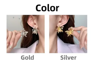Detail of elegant butterfly stud earrings shown in polished gold and silver finishes