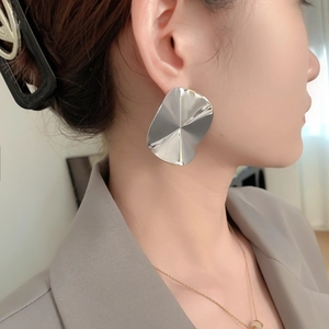 Chic silver-toned irregular geometric metal stud earrings with polished mirror finish