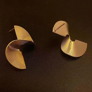 Spiral gold-plated stud earrings with unique radial texture and geometric fan shape