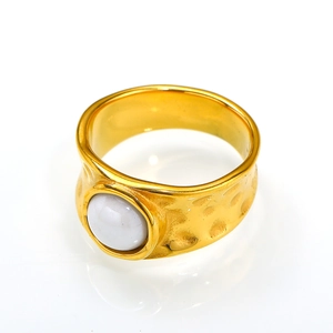 Lava textured 18K gold plated ring with white moonstone inlay on a clean white background