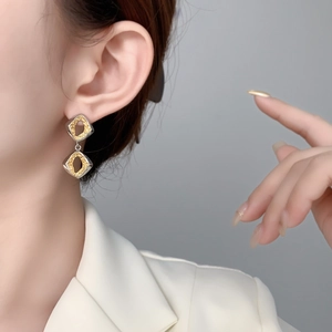 Chic geometric rhombus tassel earrings with contrasting silver frames and gold foil inlay