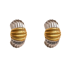 Striped gold and silver two-tone geometric earrings with shell texture on white background
