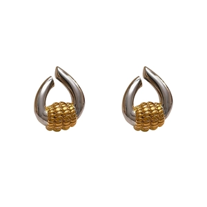 Modern gold and silver mixed metal hoop earrings with elegant beaded texture finish